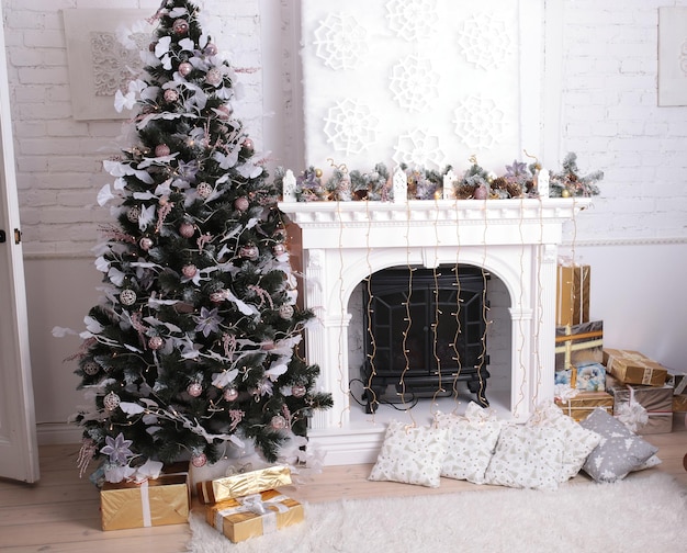 New Year's interior for a home or studio with a fireplace and a Christmas tree