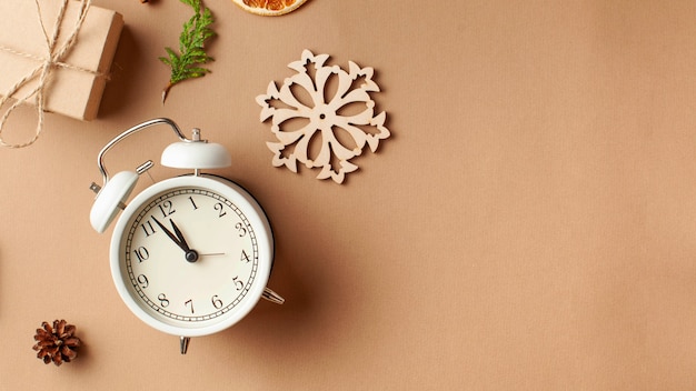 New years layout with alarm clock gift spices the concept of new years eve a gift with your own hand...