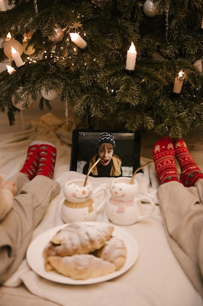 New Years socks for children in closeup on the background of the Christmas tree