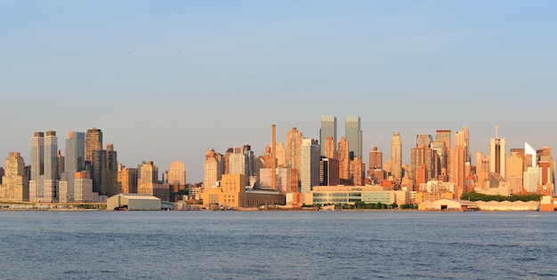 New York City Manhattan midtown skyline panorama at sunset.