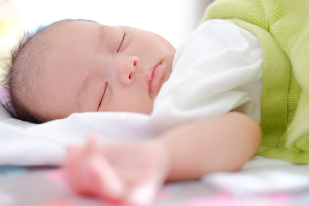 Newborn Asian baby girl sleeping