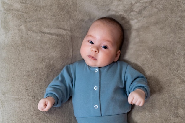 Newborn baby Cute little infant lying on bed First photo shoot