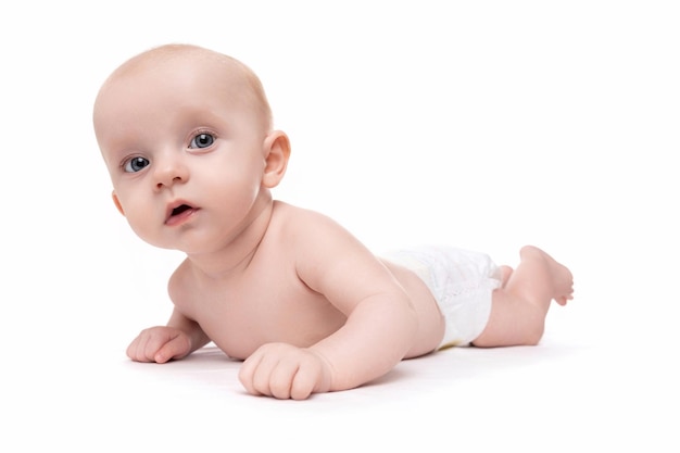 Newborn baby in diapers on a white isolated background