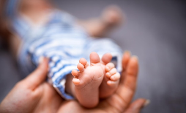 Newborn baby feet Cute feet of sleeping baby