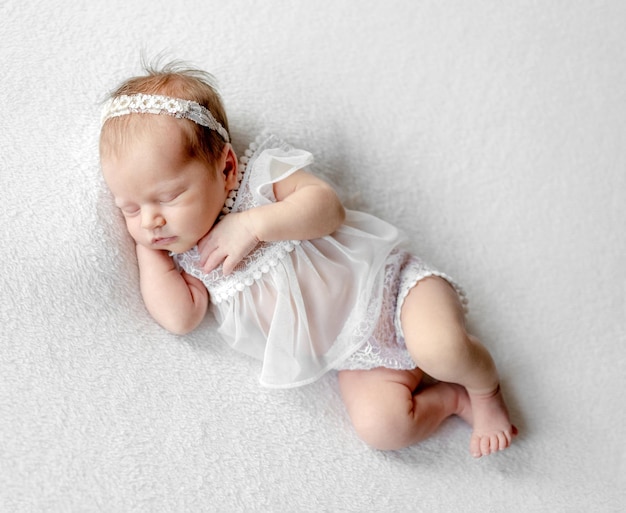 Newborn baby girl studio portrait