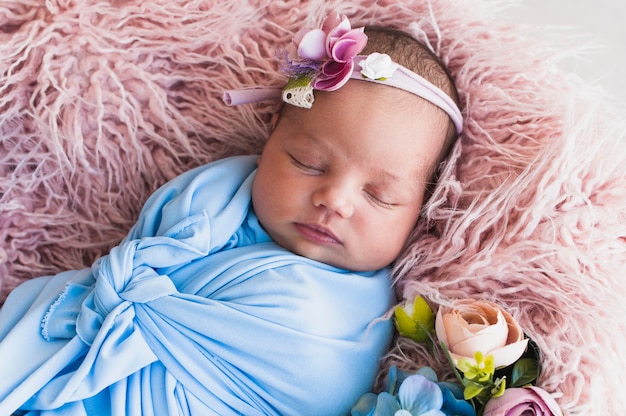 Newborn baby sleeping in blanket