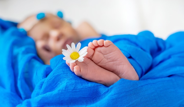 Newborn baby sleeping on a blue background. Selective focus. people.