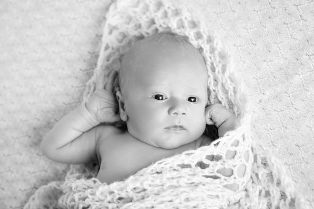 Newborn baby with open eyes Portrait of pretty newborn boy 20 days old