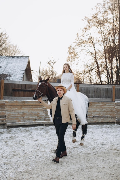 Newly married couple on ranch in winter season