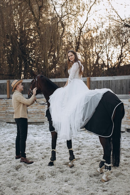 Newly married couple on ranch in winter season