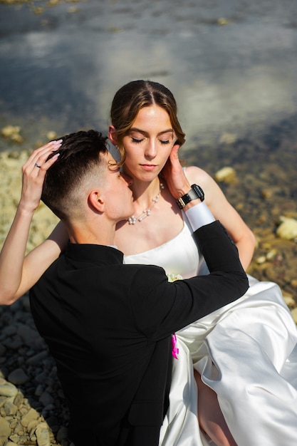 Newlywed kissing and hugs Wedding day