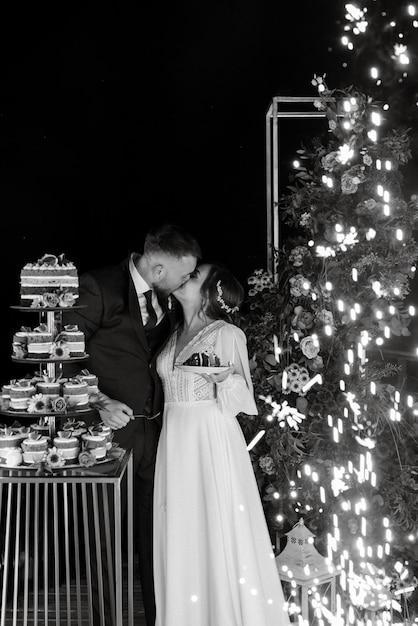 Newlyweds happily cut laugh and taste the wedding cake