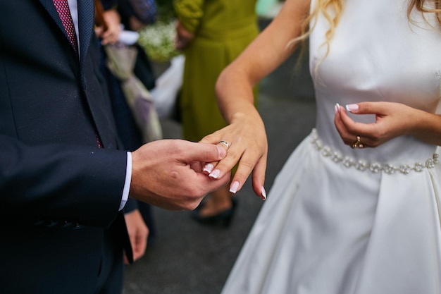 Newlyweds wear wedding rings