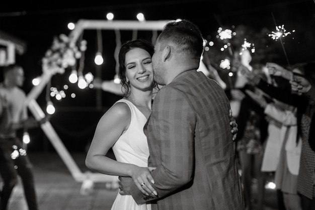 Newlyweds at a wedding of sparklers