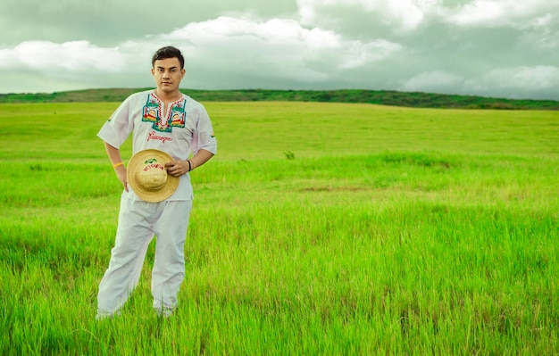 Nicaraguan man in folk costume in the field Concept of man in Nicaraguan folk costume Man wearing Central American folk costume Young man in cultural and folk costume from Nicaragua