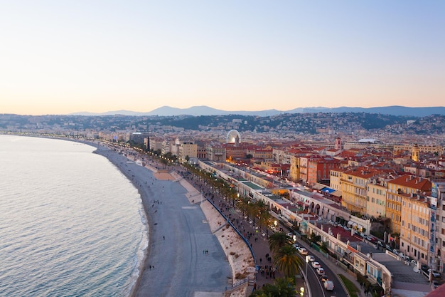 Nice beach day landscape, France.  Nice beach and famous Walkway of the English, Promenade des Anglais. Famous French touristic town