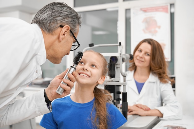 Nice girl checking vision in modern clinic