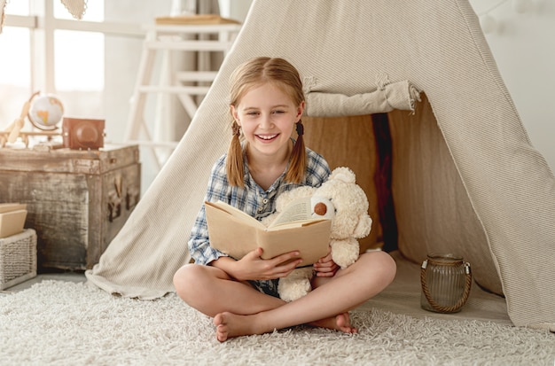 Nice little girl with paper book