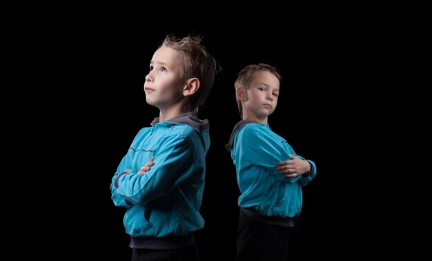 Nice little twins isolated on black background