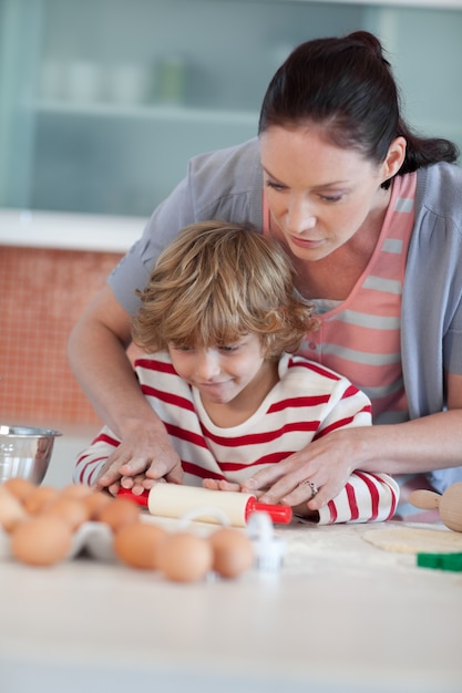 Nice mother and his son baking in a kitchen