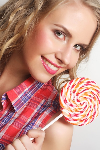 Nice young girl with lolipop