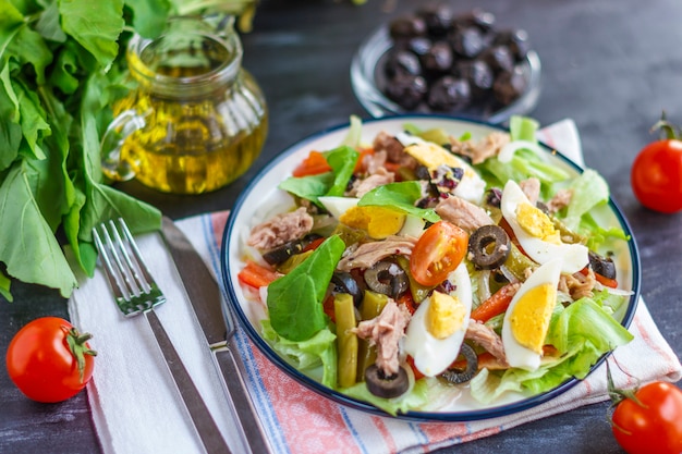 Nicoise salad with tuna, green beans, basil and fresh vegetables