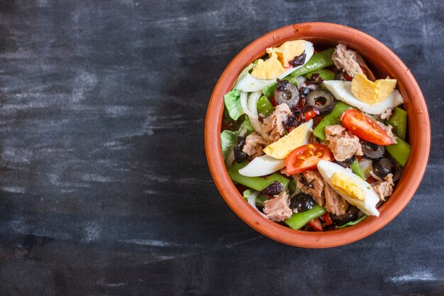 Nicoise salad with tuna, green beans, basil and fresh vegetables