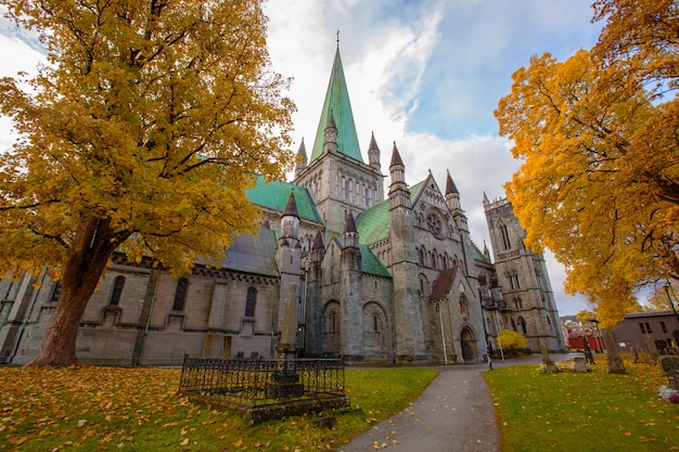 Nidaros Cathedral in autumn landscape