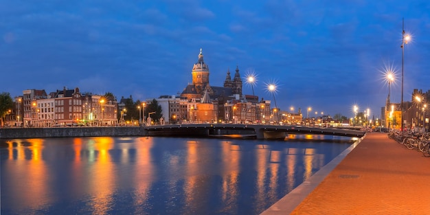 Night Amsterdam canal and Basilica Saint Nicholas