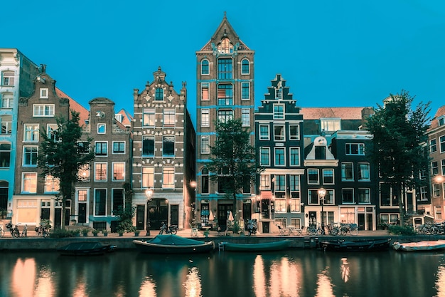 Night Amsterdam canal with dutch houses