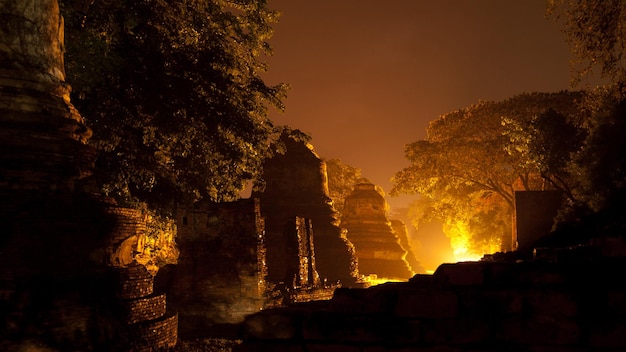 Night background of old Buddha statues in Thai religious attractions in Ayutthaya Province Thailand