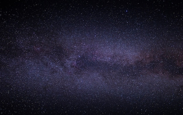 Night bright starry sky with part of the Milky Way galaxy. Wonderful summer night landscape.