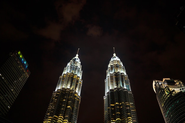 Night cityscape with Famous twin towers Petrochemical Company Petronas in Kuala Lumpur