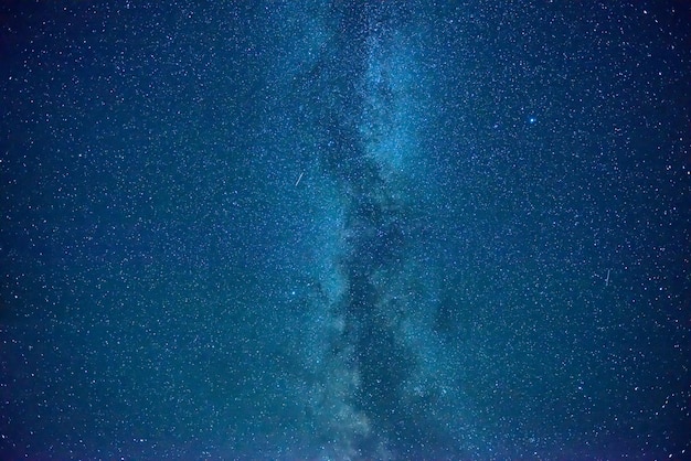 Night dark blue sky with many stars and milky way galaxy