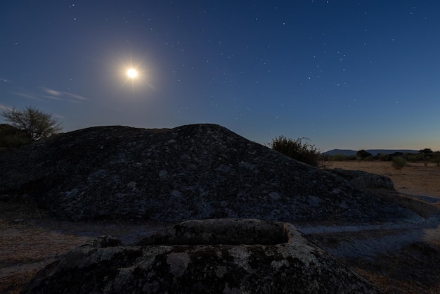 Night landscape with ancient grave in the Barruecos Natural Area. Spain.