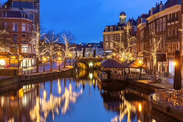 Night leiden canal oude rijn in christmas illumination south holland netherlands