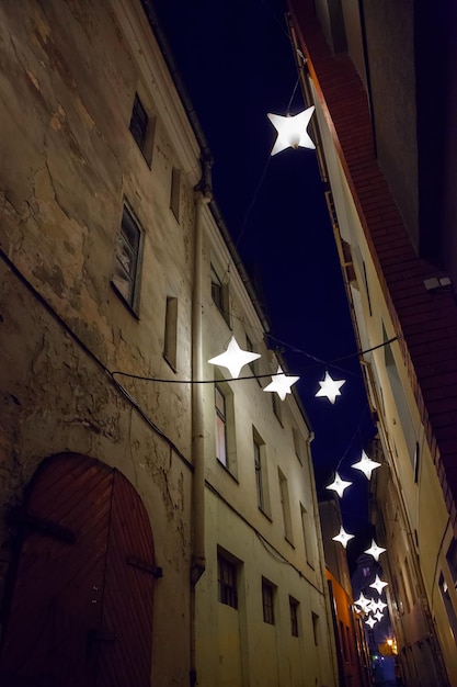 Night medieval narrow street in old city of Riga Latvia