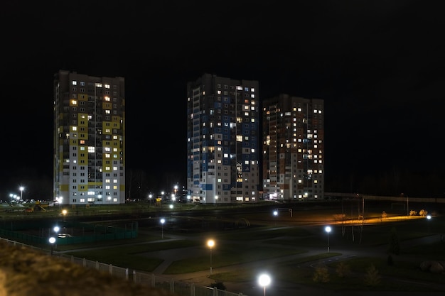 Night panorama of Light in the windows of a multistory building life in a big city