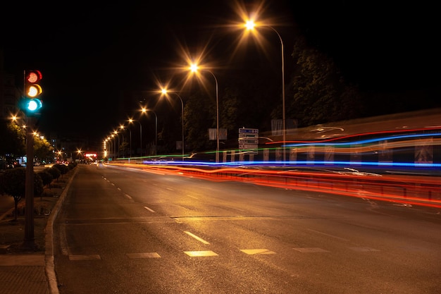 Night photography of lines of light drawn by vehicle traffic when the traffic light is green going down Calle de Alcal in Madrid