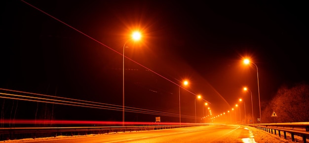 Night street with warm light. Long exposure.