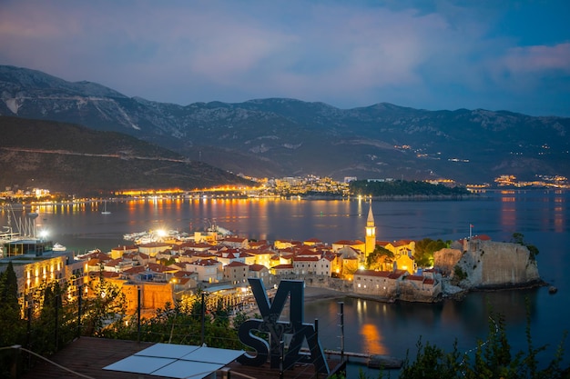 Night view of budva old town with seaview and evening lights from restaurant vista vidokovac