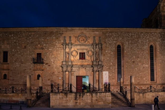 Night view of the facade of the Colegio Arzobispo Fonseca in Salamanca