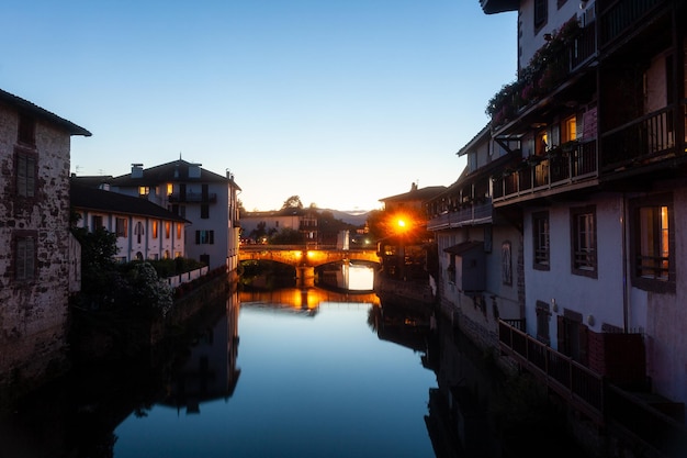 Night view of the historic bridge on the Nive River Saint Jean Pied de Port France