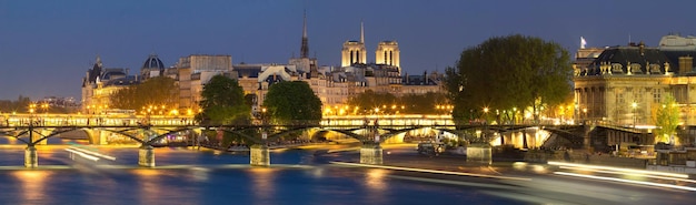 The night view of Seine river  with some famous touristic bridges like Pont des Arts