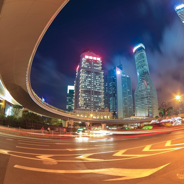 Night view of shanghai downtown under the sightseeing flyover with light trails