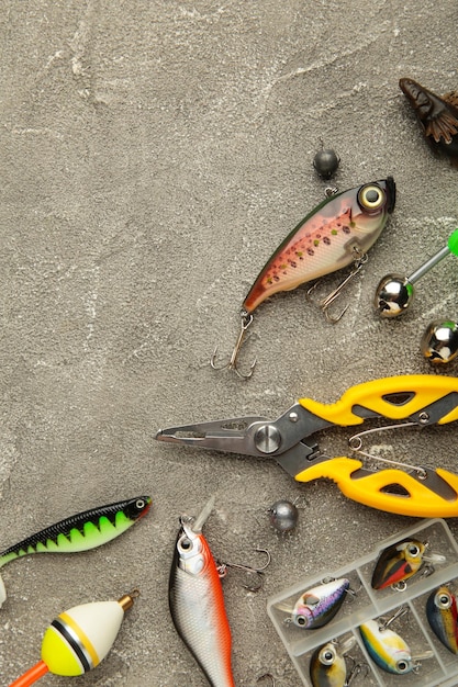 Nikolaev Ukraine 08 july 2022 Colorful fishing lures wobbler spinner on grey background different fishing baits