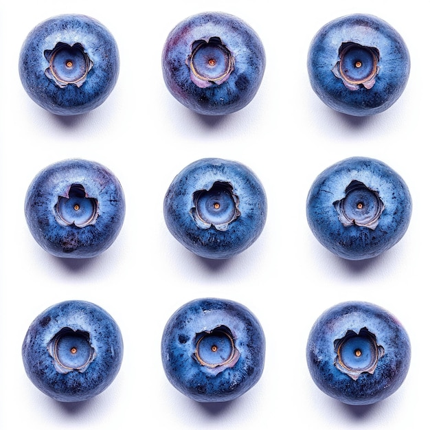 Photo nine blueberries arranged in a three by three grid against a white background