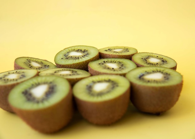 Nine kiwi halves side view concept of etiquette and healthy eating