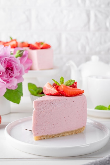 No bake cheesecake with fresh strawberries on a white wooden background Summer dessert  Copy space