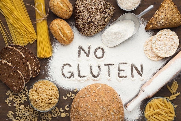 No gluten inscription framed by various healthy products: bread, pasta and flour